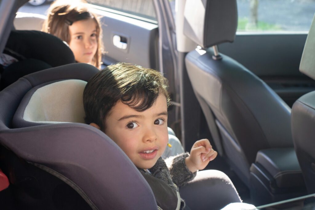 Two children in car seats.