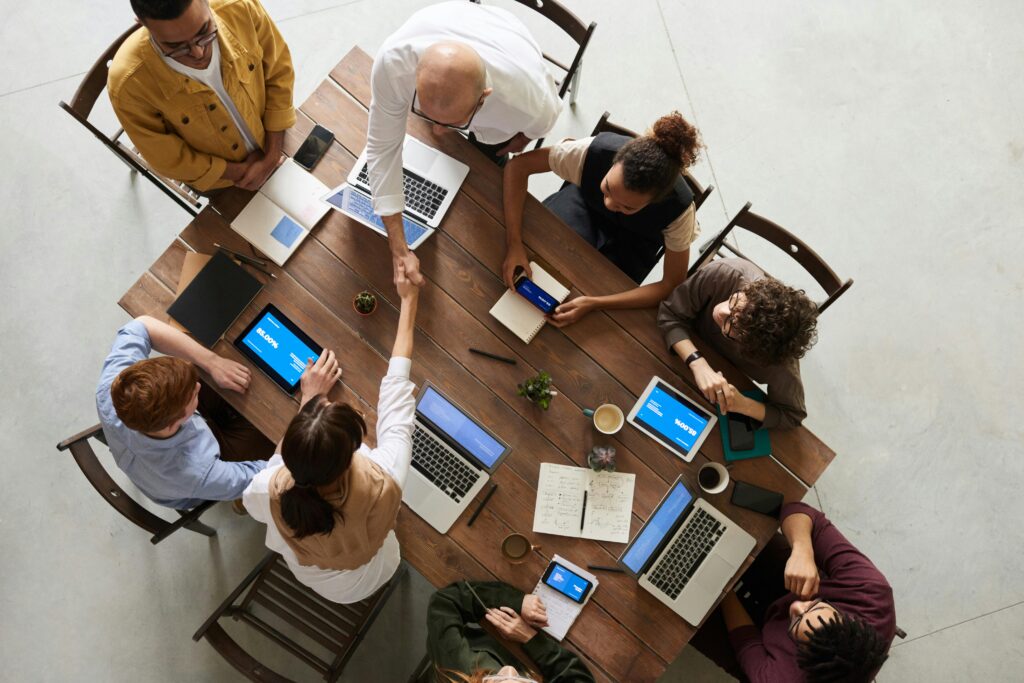Overhead view of conference table with laptops